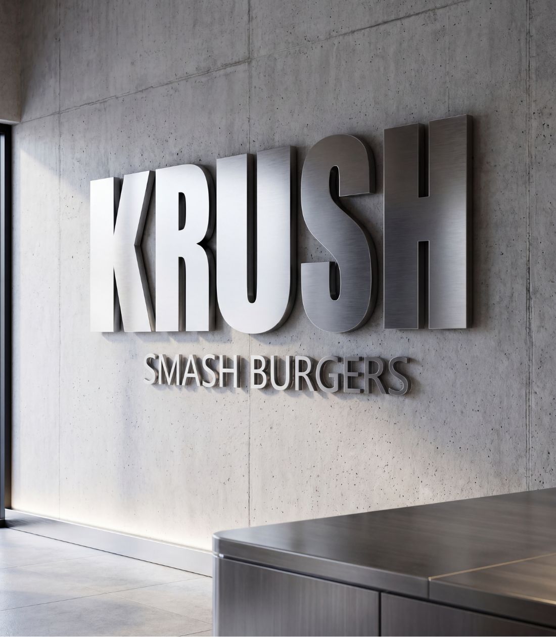 KRUSH Smash Burgers Bangkok — brushed stainless wordmark on raw concrete wall